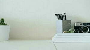 Clean Office Building: Desk Decor with Cactus, Stationery, and Vintage Camera