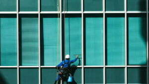 Commercial Cleaning in Denver: Skilled Worker Cleaning Building Windows