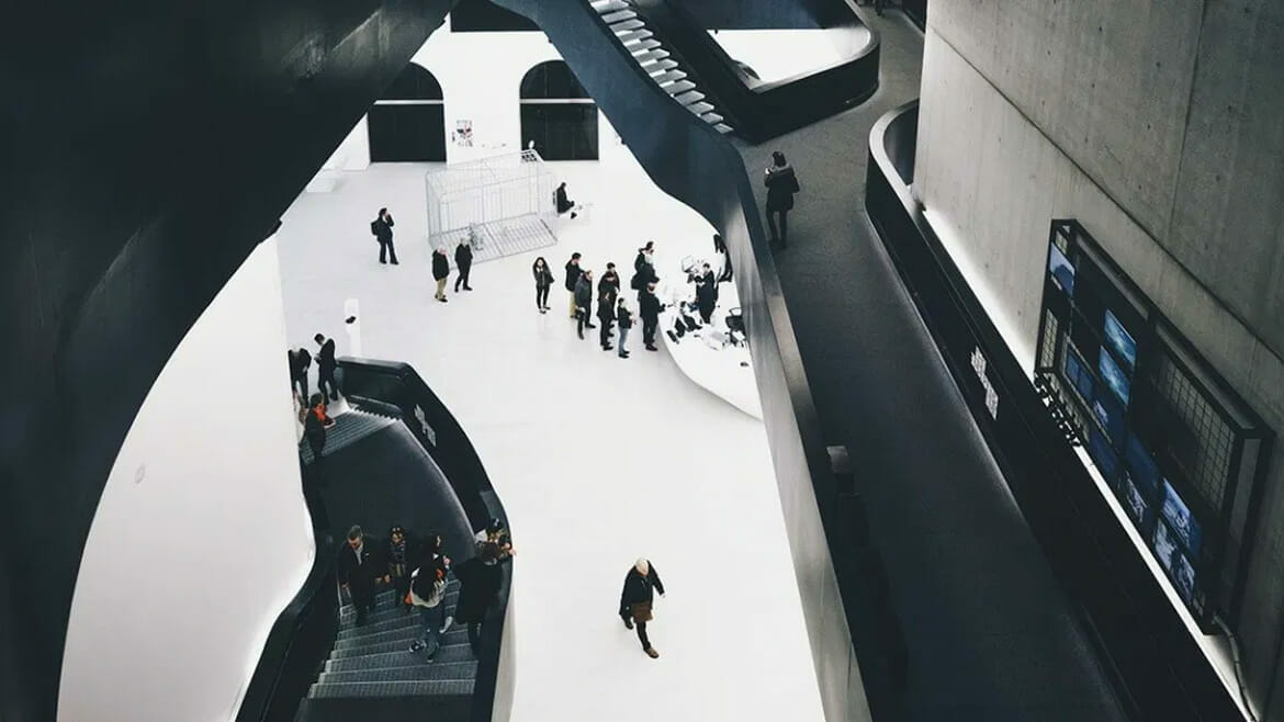 Facilities Services: Museum Interior with Staircases and Visitors