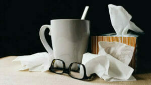 Flu Season Healthcare Cleaning: Tea, Tissues, Box of Tissues, and Glasses