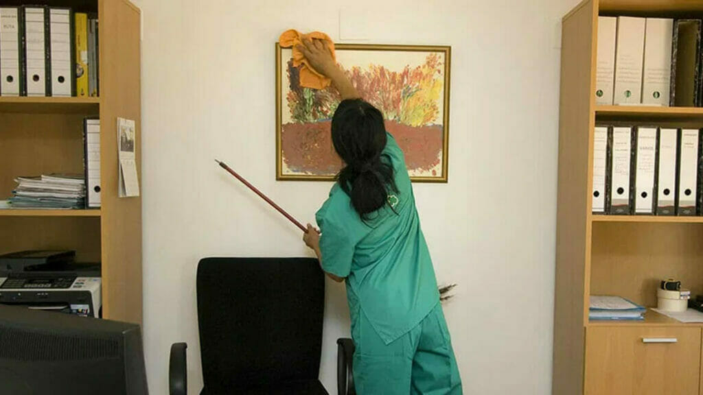 Professional Cleaning Staff: Woman Cleaning Office