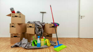 End of Lease Cleaning: Apartment with Boxes and Cleaning Supplies