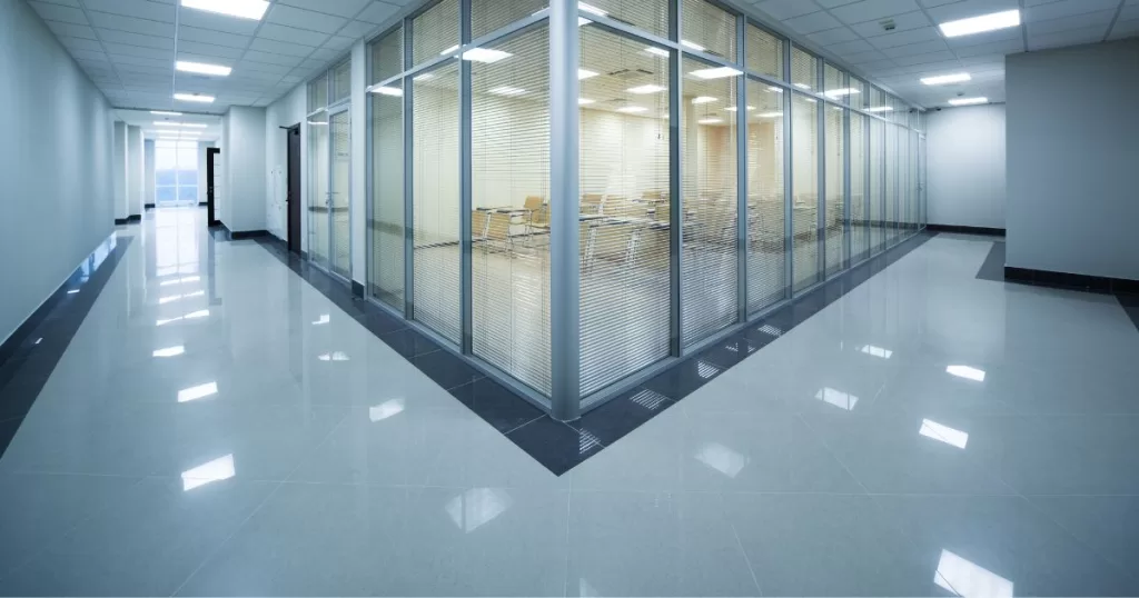 Floor Care | Two corridors converging with a conference room in the center.